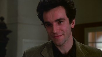 Movie still from “The Unbearable Lightness of Being” (1988), directed by Philip Kaufman – A person wearing a jacket; Close Up shot, Over the shoulder angle