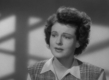 Movie still from “The Uninvited” (1944), directed by Lewis Allen – An old photo of a woman in a plaid shirt; Close Up shot, Low angle