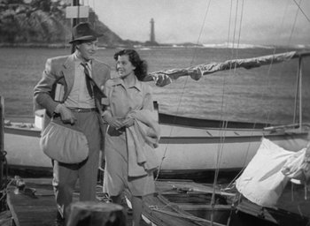 Movie still from “The Uninvited” (1944), directed by Lewis Allen – A man and a woman walking on the deck of a boat; Wide shot, Low angle