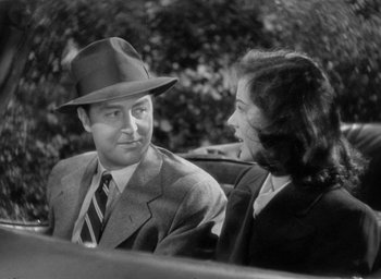 Movie still from “The Uninvited” (1944), directed by Lewis Allen – A man and a woman are talking to each other; Close Up shot, Over the shoulder angle