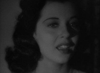 Movie still from “The Uninvited” (1944), directed by Lewis Allen – A black - and - white photo of a woman's face; Close Up shot, Low angle