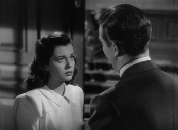 Movie still from “The Uninvited” (1944), directed by Lewis Allen – A man and a woman are talking to each other; Close Up shot, High angle