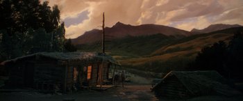 Movie still from “The Unsinkable Molly Brown” (1964), directed by Charles Walters – A painting of a cabin in the mountains; Extreme Wide shot, Low angle