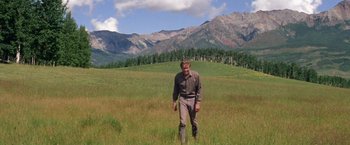 Movie still from “The Unsinkable Molly Brown” (1964), directed by Charles Walters – A man standing in the middle of an open field; Wide shot, Low angle