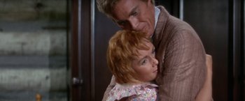 Movie still from “The Unsinkable Molly Brown” (1964), directed by Charles Walters – A man and a woman embracing each other; Close Up shot, High angle