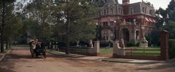 Movie still from “The Unsinkable Molly Brown” (1964), directed by Charles Walters – A view of an old house from across the street; Extreme Wide shot, High angle