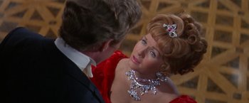Movie still from “The Unsinkable Molly Brown” (1964), directed by Charles Walters – A man and a woman in formal wear looking at each other; Close Up shot, Over the shoulder angle