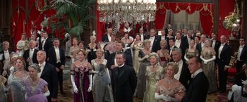 Movie still from “The Unsinkable Molly Brown” (1964), directed by Charles Walters – A large group of people dressed in formal wear; Wide shot, High angle