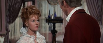 Movie still from “The Unsinkable Molly Brown” (1964), directed by Charles Walters – An older man and a woman in a room; Close Up shot, Over the shoulder angle