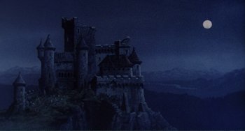 Movie still from “The Vampire Lovers” (1970), directed by Roy Ward Baker – A castle on top of a mountain at night; Extreme Wide shot, Low angle