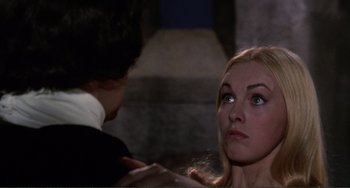 Movie still from “The Vampire Lovers” (1970), directed by Roy Ward Baker – A man and a woman looking at one another; Close Up shot, Over the shoulder angle