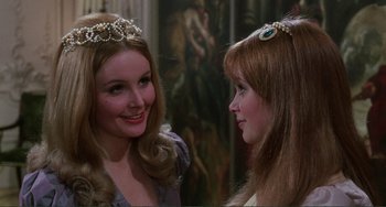 Movie still from “The Vampire Lovers” (1970), directed by Roy Ward Baker – Two young women in a room with a painting behind them; Close Up shot, Over the shoulder angle