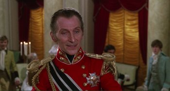 Movie still from “The Vampire Lovers” (1970), directed by Roy Ward Baker – A person wearing a uniform; Close Up shot, Over the shoulder angle