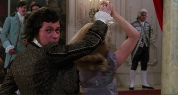 Movie still from “The Vampire Lovers” (1970), directed by Roy Ward Baker – A man and a woman are dancing in a room; Medium shot, Over the shoulder angle