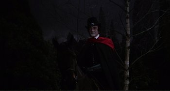 Movie still from “The Vampire Lovers” (1970), directed by Roy Ward Baker – A man dressed as a vampire on a horse; Medium shot, Low angle