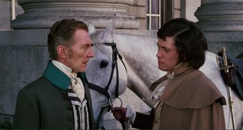 Movie still from “The Vampire Lovers” (1970), directed by Roy Ward Baker – A man and a woman standing in front of a horse; Medium shot, Over the shoulder angle