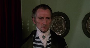 Movie still from “The Vampire Lovers” (1970), directed by Roy Ward Baker – A person wearing a costume; Close Up shot, Over the shoulder angle