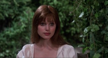 Movie still from “The Vampire Lovers” (1970), directed by Roy Ward Baker – A person with long hair; Close Up shot, Over the shoulder angle