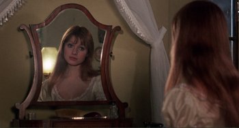 Movie still from “The Vampire Lovers” (1970), directed by Roy Ward Baker – A woman looking in the mirror in front of a mirror; Close Up shot, Over the shoulder angle