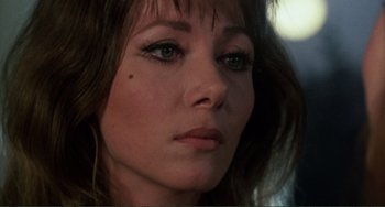 Movie still from “The Vampire Lovers” (1970), directed by Roy Ward Baker – A woman's face with long lashes; Close Up shot, Over the shoulder angle