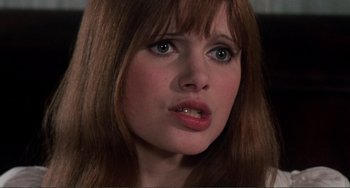 Movie still from “The Vampire Lovers” (1970), directed by Roy Ward Baker – A person with long hair; Close Up shot, High angle