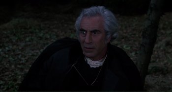 Movie still from “The Vampire Lovers” (1970), directed by Roy Ward Baker – An older man with a gray hair and a white beard; Close Up shot, Over the shoulder angle