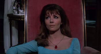 Movie still from “The Vampire Lovers” (1970), directed by Roy Ward Baker – A woman in a blue shirt is looking up; Close Up shot, Low angle