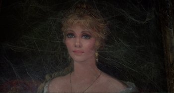Movie still from “The Vampire Lovers” (1970), directed by Roy Ward Baker – A painting of a beautiful woman with blonde hair and blue eyes; Close Up shot, Overhead angle