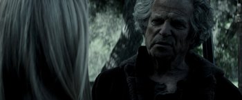Movie still from “The Veil” (2016), directed by Phil Joanou – An old man with white hair looking at the camera; Close Up shot, Over the shoulder angle