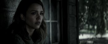 Movie still from “The Veil” (2016), directed by Phil Joanou – A woman with long hair is looking at the camera; Close Up shot, Over the shoulder angle