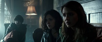 Movie still from “The Veil” (2016), directed by Phil Joanou – Two women sitting next to each other in a dark room; Close Up shot, Over the shoulder angle