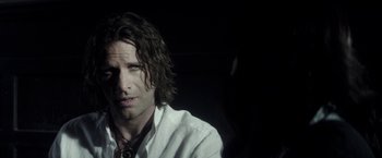 Movie still from “The Veil” (2016), directed by Phil Joanou – A person with long hair; Close Up shot, Over the shoulder angle