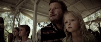 Movie still from “The Veil” (2016), directed by Phil Joanou – A man and a little girl looking up at the sky; Close Up shot, Low angle