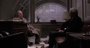 Movie still from “The Verdict” (1982), directed by Sidney Lumet – Two men sitting in a room with papers on the floor; Wide shot, High angle