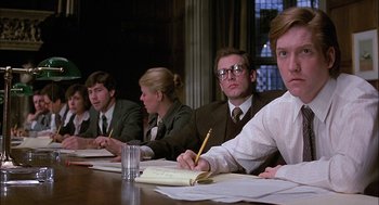 Movie still from “The Verdict” (1982), directed by Sidney Lumet – A group of people sitting at a table with papers; Medium shot, Over the shoulder angle
