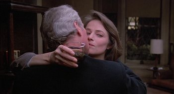 Movie still from “The Verdict” (1982), directed by Sidney Lumet – A man and a woman kissing in front of a window; Close Up shot, Over the shoulder angle