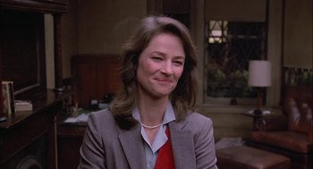 Movie still from “The Verdict” (1982), directed by Sidney Lumet – A person wearing a suit and smiling; Close Up shot, Low angle