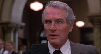 Movie still from “The Verdict” (1982), directed by Sidney Lumet – An older man wearing a suit and a tie; Close Up shot, Low angle