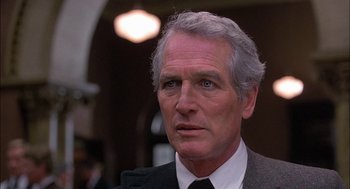 Movie still from “The Verdict” (1982), directed by Sidney Lumet – An older man wearing a suit and a tie; Close Up shot, Over the shoulder angle