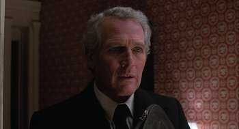 Movie still from “The Verdict” (1982), directed by Sidney Lumet – An older man wearing a suit and tie; Close Up shot, Low angle