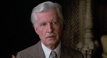 Movie still from “The Verdict” (1982), directed by Sidney Lumet – An older man wearing a suit and tie; Close Up shot, Over the shoulder angle