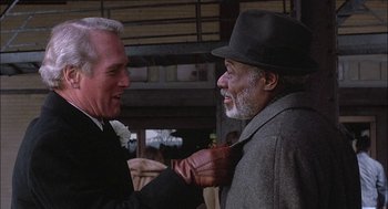 Movie still from “The Verdict” (1982), directed by Sidney Lumet – Two men are talking to each other outside; Close Up shot, Over the shoulder angle