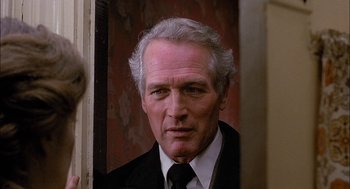 Movie still from “The Verdict” (1982), directed by Sidney Lumet – A person wearing a suit and tie; Close Up shot, Over the shoulder angle