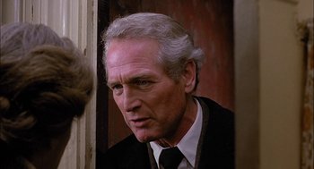 Movie still from “The Verdict” (1982), directed by Sidney Lumet – An older man in a suit and tie looking to his left; Close Up shot, Over the shoulder angle