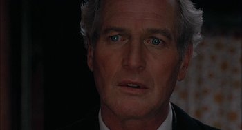 Movie still from “The Verdict” (1982), directed by Sidney Lumet – A person wearing a suit and tie; Close Up shot, Low angle