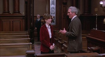 Movie still from “The Verdict” (1982), directed by Sidney Lumet – A man and a woman talking in a courtroom; Medium shot, Over the shoulder angle