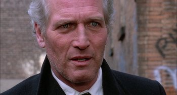 Movie still from “The Verdict” (1982), directed by Sidney Lumet – An older man wearing a suit and tie; Close Up shot, Over the shoulder angle