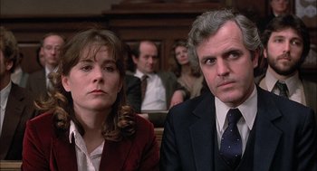 Movie still from “The Verdict” (1982), directed by Sidney Lumet – A man and a woman sitting next to each other in a courtroom; Close Up shot, Low angle