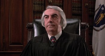 Movie still from “The Verdict” (1982), directed by Sidney Lumet – An older man wearing a robe and a tie; Close Up shot, Low angle