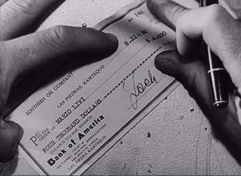 Movie still from “The Wages of Fear” (1953), directed by Henri-Georges Clouzot – A person is holding a check in their hand; Extreme Close Up shot, Low angle